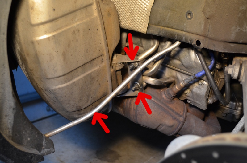 Disconnect the muffler supports and rear bumper cover support bar