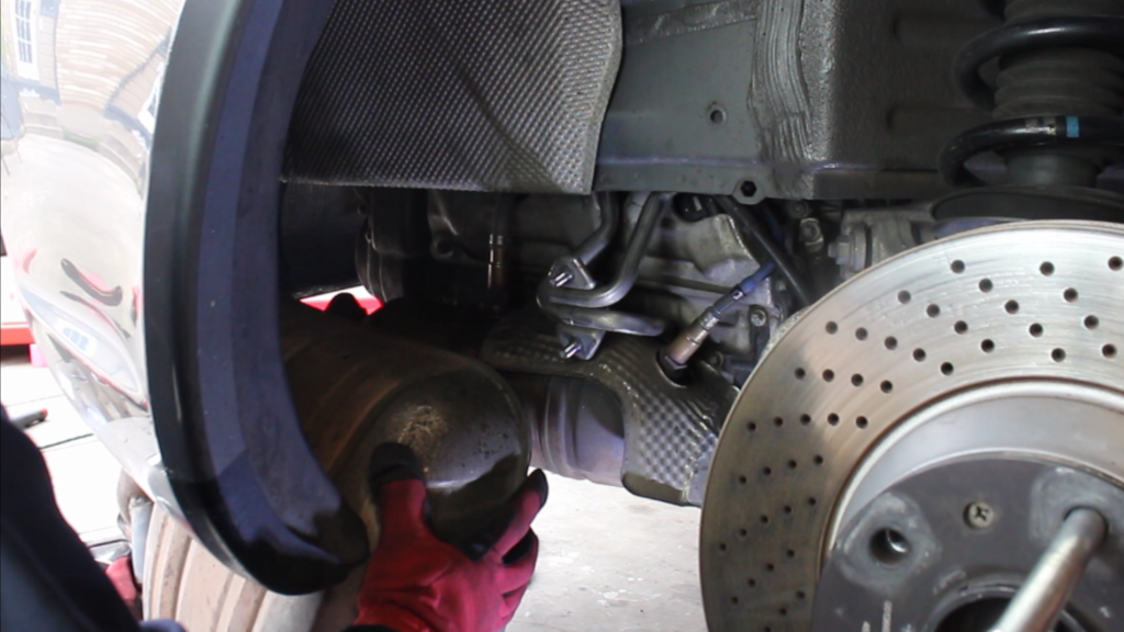 Remove the side muffler.